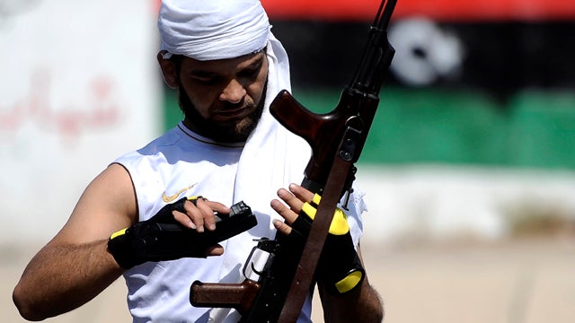 A rebel fighter is seen in Tripoli, Libya, Aug. 23, 2011. Libyan rebels declared the era of Muammar Qaddafi over after storming the capital, but one of the veteran strongman's sons insisted the battle was far from done as he defiantly refuted reports of h 