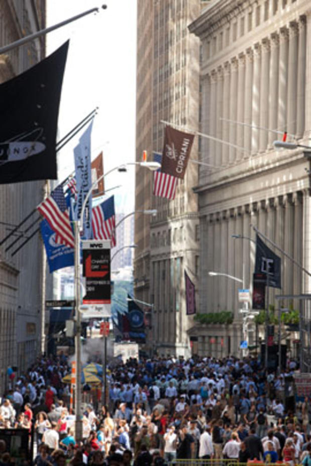 Crowds stand on Wall Street after a 5.9 earthquake struck on Aug. 23, 2011, in New York. 