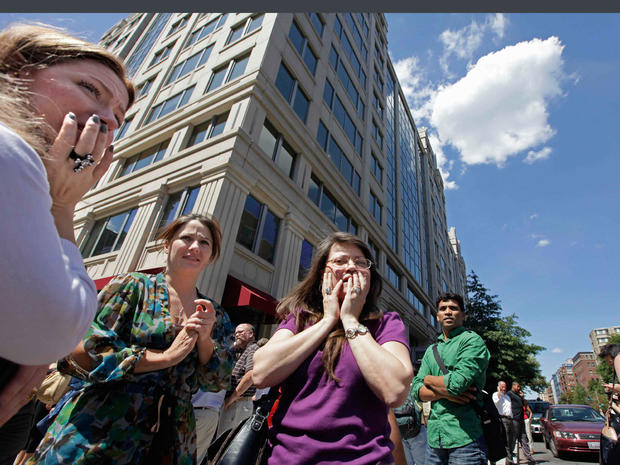 Office workers gather on the sidewalk in downtown Washington, Tuesday, Aug. 23, 2011, moments after a 5.9 magnitude tremor shook the nation's capitol. 
