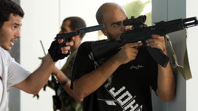 Rebels search a luxury hotel in Tripoli 