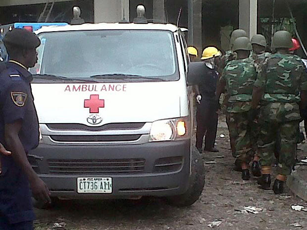 irefighters and rescue workers after a large explosion struck the United Nations' main office in Nigeria's capital Abuja 