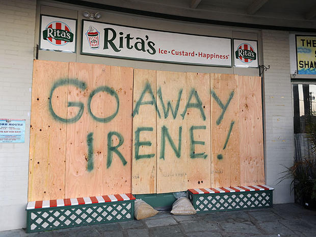 A sign saying 'Go Away Irene!' is spray painted on a baorded up storefront in preparation for Hurricane Irene August 26, 2011 in Cape May, New Jersey.  