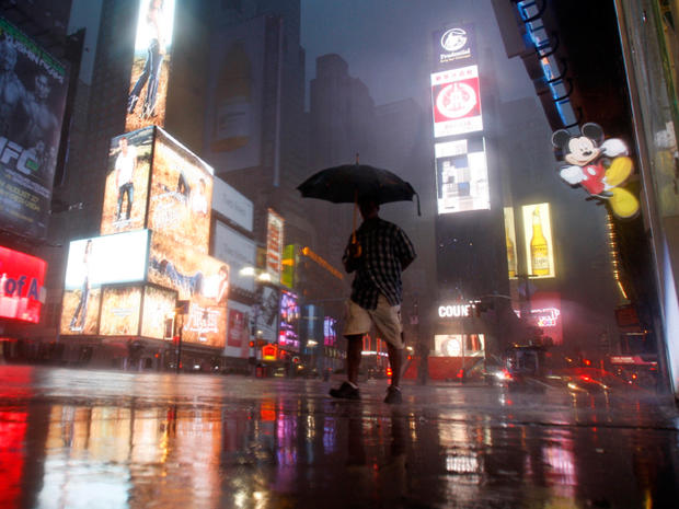 A man walks in Times Square as Hurricane Irene arrives 