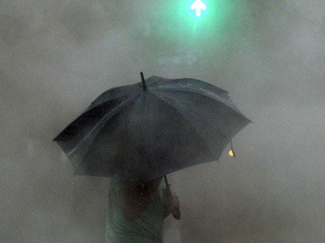 A man walks around in the rain 