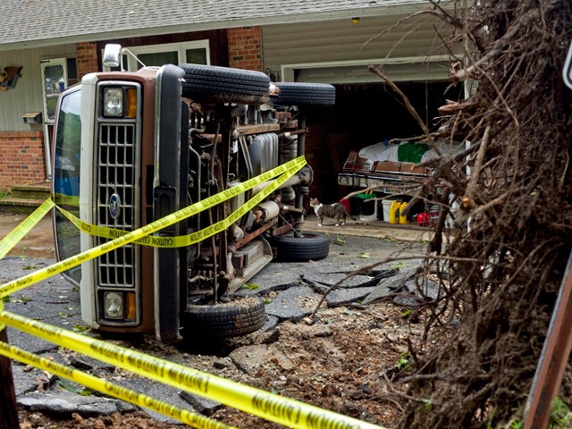 Ford Club Wagon rests on its side 
