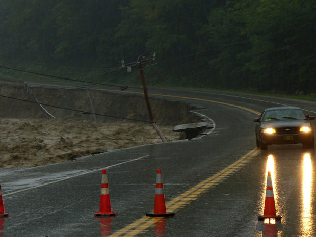 Route 4 in Mendon, Vt., collapses while the Mendon Brook overflows as Tropical Storm Irene passes through Vermont,  Aug, 28, 2011.   