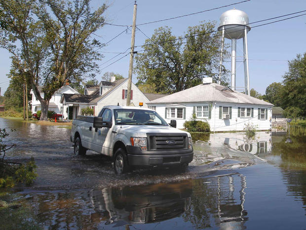 A truck drives down a flooded street in Columbia, N.C., Aug. 28, 2011 after Hurricane Irene.  