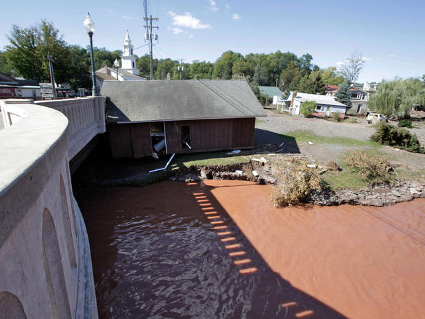 A house rests against a bridge after floating down the Batavia Kill stream after Tropical Storm Irene flooded parts of the town,  Aug. 30, 2011 in Windham, N.Y.  