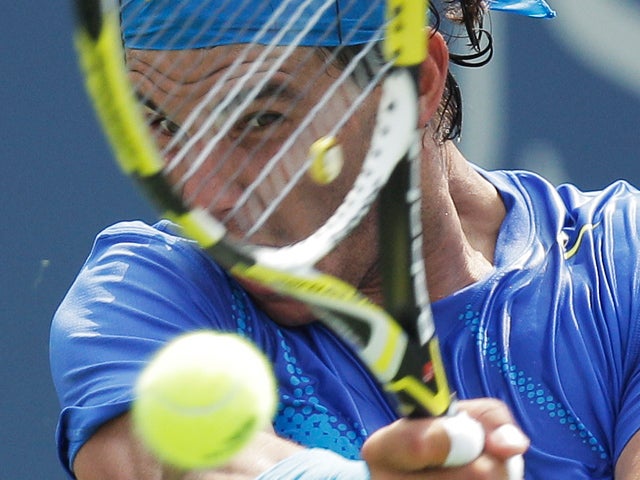 Rafael Nadal returns a shot 