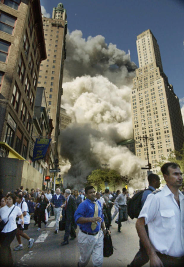 south tower collapses as people run to safety 