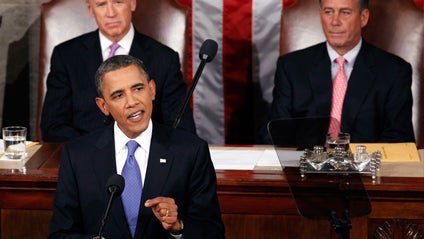 President Barack Obama delivers a speech to a joint session of Congress at the Capitol in Washington, Thursday, Sept. 8, 2011. Watching are Vice President Joe Biden and House Speaker John Boehner. 