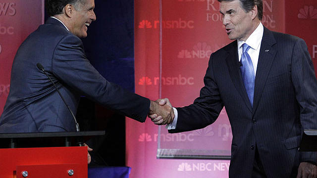 Republican presidential candidates former Massachusetts Gov. Mitt Romney, left, and Texas Gov. Rick Perry shake hands at the finish of a Republican presidential candidate debate at the Reagan Library, Sept. 7, 2011, in Simi Valley, Calif. 