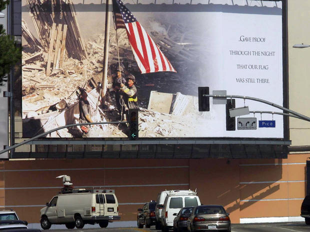 A huge mural showing a picture of firefighters raising the U.S. flag over the ruins of the World Trade Center is displayed outside the 20th Century Fox Studios in Los Angeles Sept. 21, 2001. Security is being enhanced at movie studios in Los Angeles after 