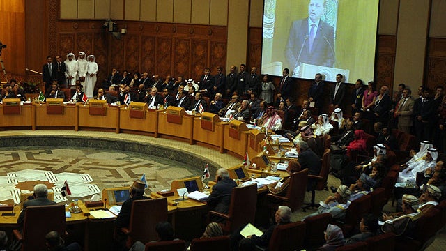 Turkish prime minister Recep Tayyip Erdogan is seen on a screen as he gives a speech to the Arab league members during an Arab league meeting in its headquarters in Cairo, Egypt, Sept. 13, 2011.  