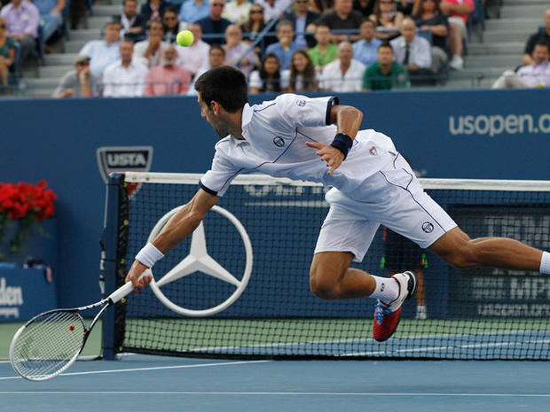Novak Djokovic returns a shot to Rafael Nadal  