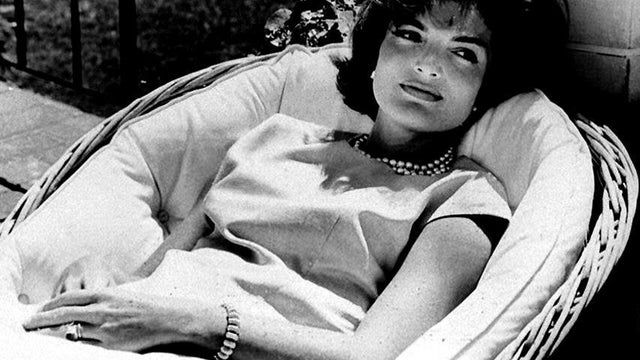 Former first lady Jacqueline Kennedy Onassis relaxes in a chair in December 1960, a few weeks after John F. Kennedy won the presidential election. 