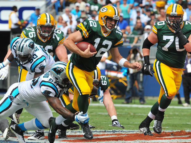 Aaron Rodgers rushes for a gain 