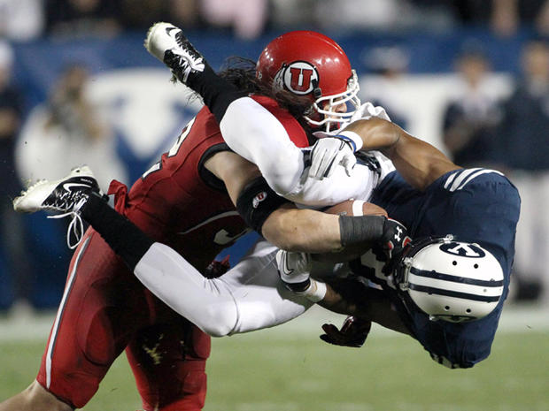 BYU wide receiver Ross Apo is upended  