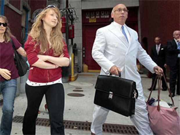 Caroline Giuliani, 20, center, leaves the 19th precinct Wednesday, Aug. 4, 2010 in New York. A law enforcement official says Rudy Giuliani's daughter was arrested after she was seen on video pocketing makeup at a New York City cosmetic store. (AP Photo/Fr 