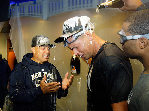 Reggie Jackson celebrates with Alex Rodriguez after the Yankees clinched 