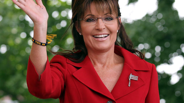 Former Alaska Gov. Sarah Palin waves during a Tea Party Express rally Sept. 5, 2011, in Manchester, N.H. 