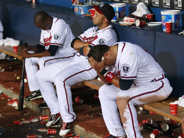 Cristhian Martinez, Alex Gonzalez and Martin Pardo sit on the bench 