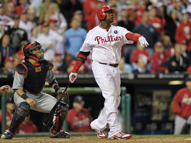Ryan Howard watches his three-run home run  