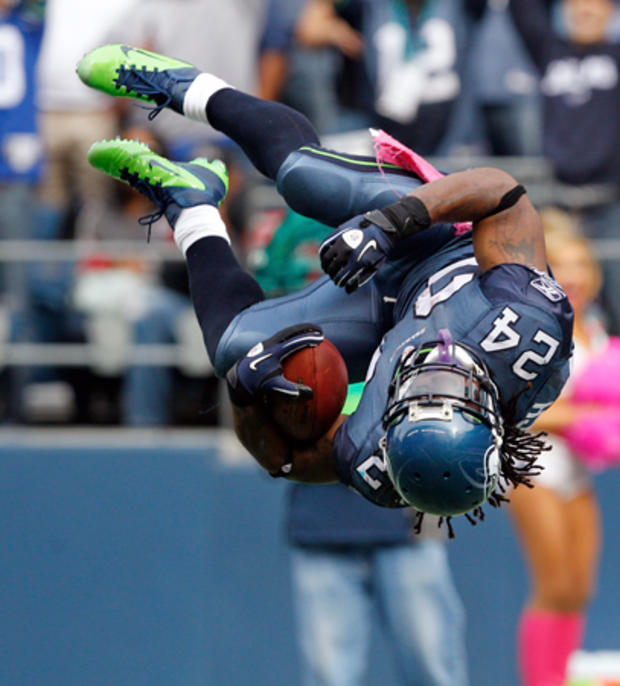 Marshawn Lynch launches himself in to a flip  