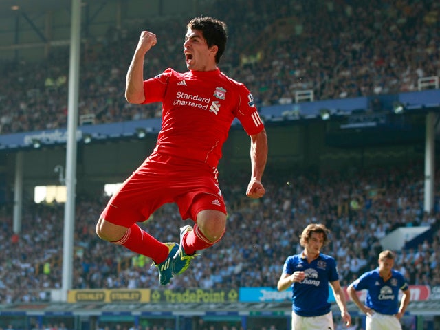 Luis Suarez celebrates after scoring a goal  