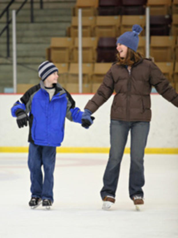 12/31/11- Best Ways to Stay Fit During Winter- mother and son ice skating 