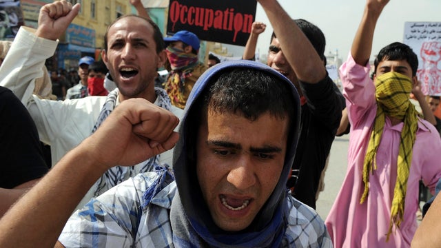 Afghan protesters hold placards as they shout anti-U.S. slogans during a demonstration ahead of the 10th anniversary of the U.S.-led invasion in Kabul Oct. 6, 2011. Some 200 people demonstrated in Afghanistan's capital. The protesters shouted "death to Am 
