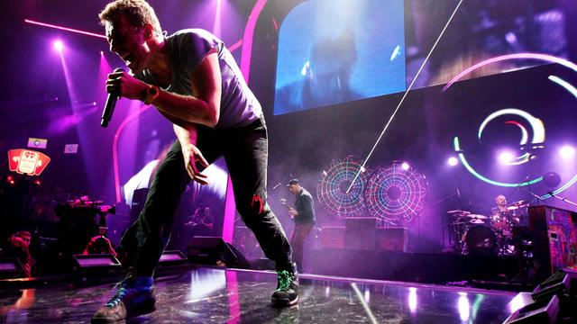 Will Champion from band Coldplay during rehearsals for a special