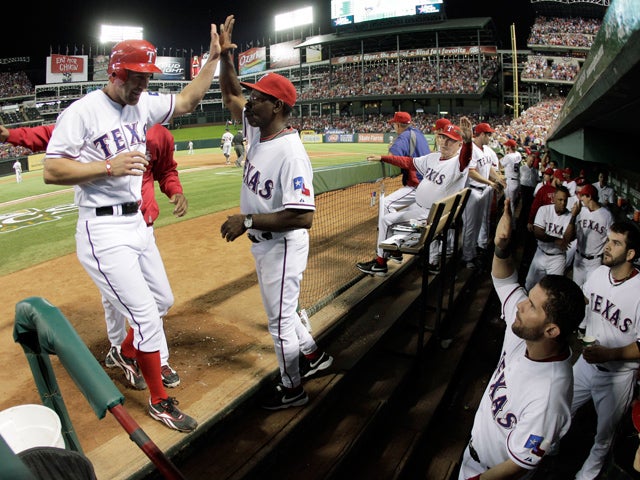 David Murphy is greeted by manager Ron Washington 