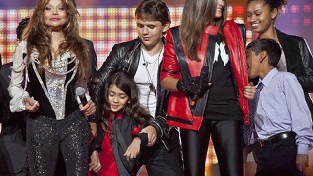 From left, Latoya Jackson, Blanket Jackson, Prince Jackson, Paris Jackson and others join together on stage for the finale of the Michael Forever the Tribute Concert, at the Millennium Stadium in Cardiff, Wales, Saturday, Oct. 8, 2011.  