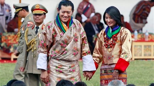 Bhutan King Jigme Khesar Namgyal Wangchuck, center left, and Queen Jetsun Pema meet locals after they were married Thursday 