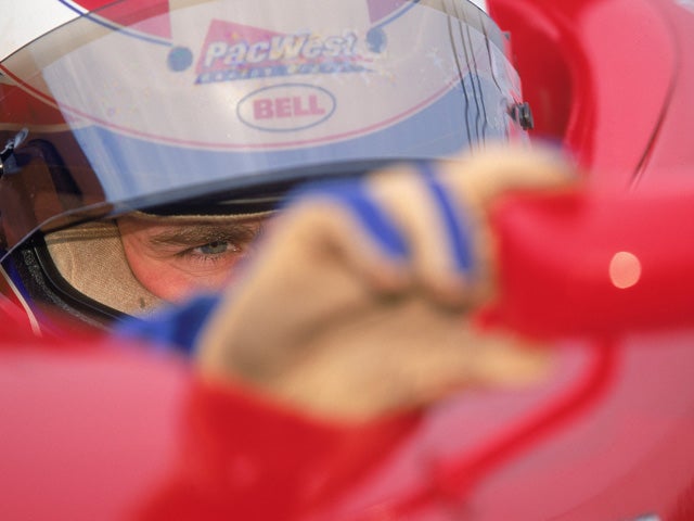 Daniel Wheldon adjusts his mirror 