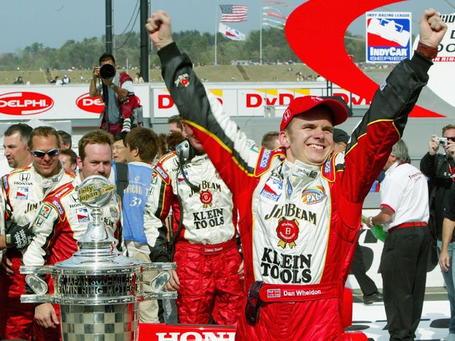 Dan Wheldon celebrates winning the Indy Japan 300 Mile 