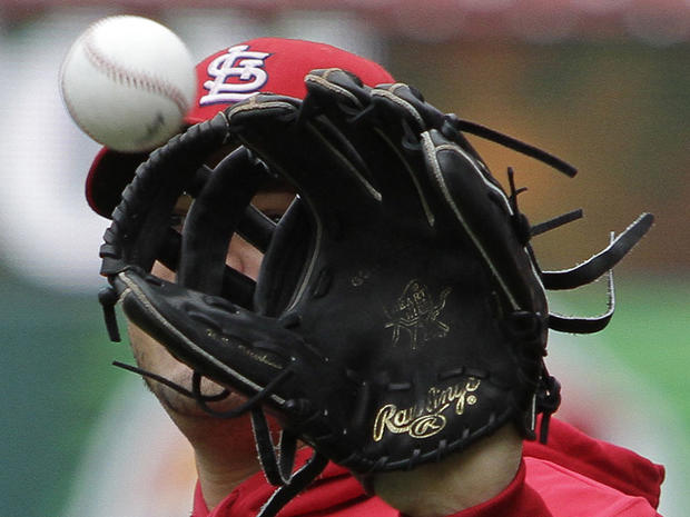 Yadier Molina catches a ball during practice 
