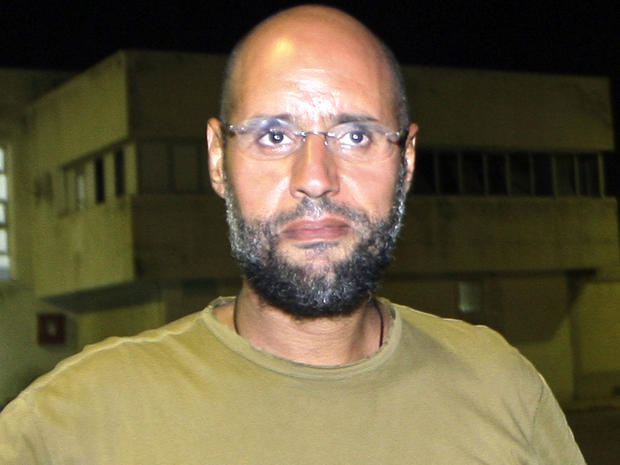 Saif al-Islam Qaddafi, son of ousted Libyan leader Muammar Qaddafi, appears in front of journalists at his father's residential complex in the Libyan capital of Tripoli Aug. 23, 2011. 