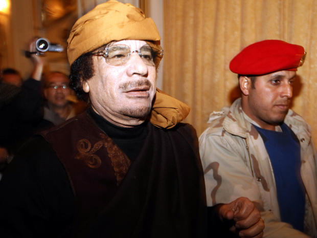 In this March 8, 2011, file photo, Libyan strongman Muammar Qaddafi arrives at the Rixos hotel in the capital of Tripoli. 