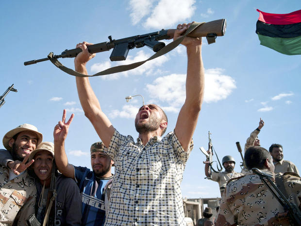 Libyan revolutionary fighters celebrate in Muammar Qaddafi's hometown of Sirte Oct. 20, 2011. 