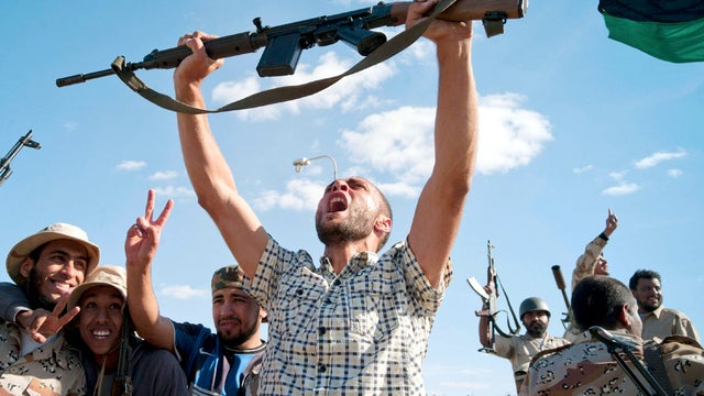 Libyan revolutionary fighters celebrate in Muammar Qaddafi's hometown of Sirte Oct. 20, 2011. 