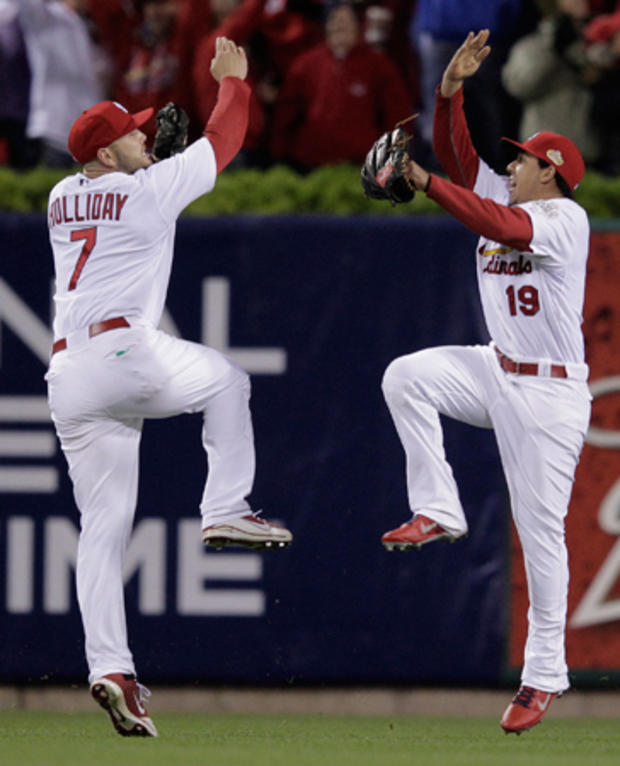 Matt Holliday and Jon Jay celebrate after the final out  