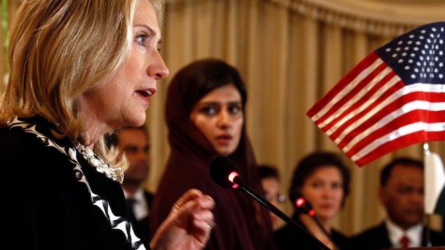 Secretary of State Hillary Clinton, left, speaks as Pakistan Foreign Minister Hina Rabbani Khar looks on during a joint news conference in Islamabad, Pakistan, Oct. 21, 2011. Clinton said Friday that extremists have been able to operate from Pakistani soi 