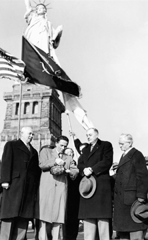 From left to right, New York Judge Samuel Leibowitz; Abba Hushi, holding a pitcher of soil brought from Palestine in 1917; New York Deputy Mayor John J. Bennett; and Joseph Schlossberg are seen Dec. 1, 1947, during a ceremony at the base of the Statue of  