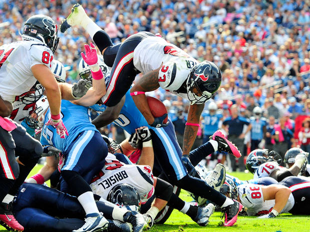 Arian Foster dives into the end zone for a touchdown 