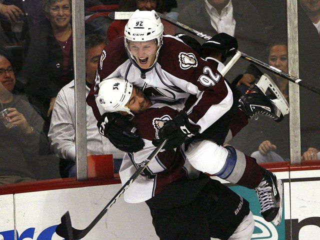 Gabriel Landeskog leaps into the arms of Daniel Winnik  