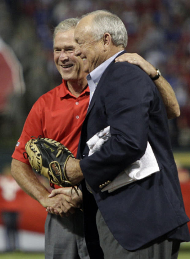 Former President George W. Bush shakes hands with Nolan Ryan  