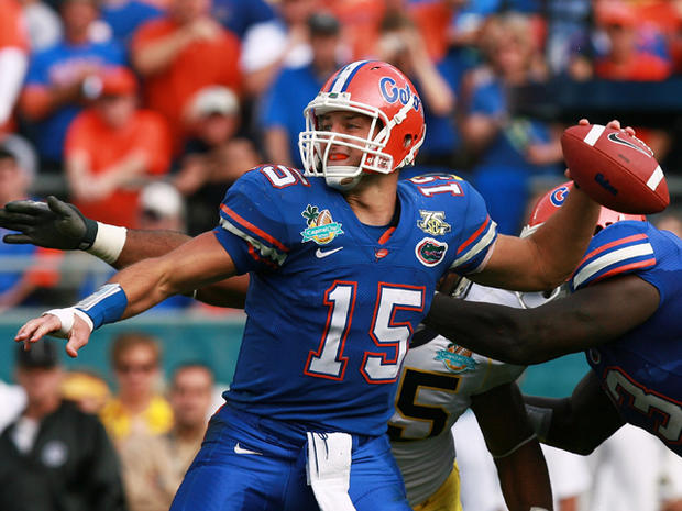 Tim Tebow throws a pass 