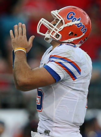 Tim Tebow celebrates his touchdown run 